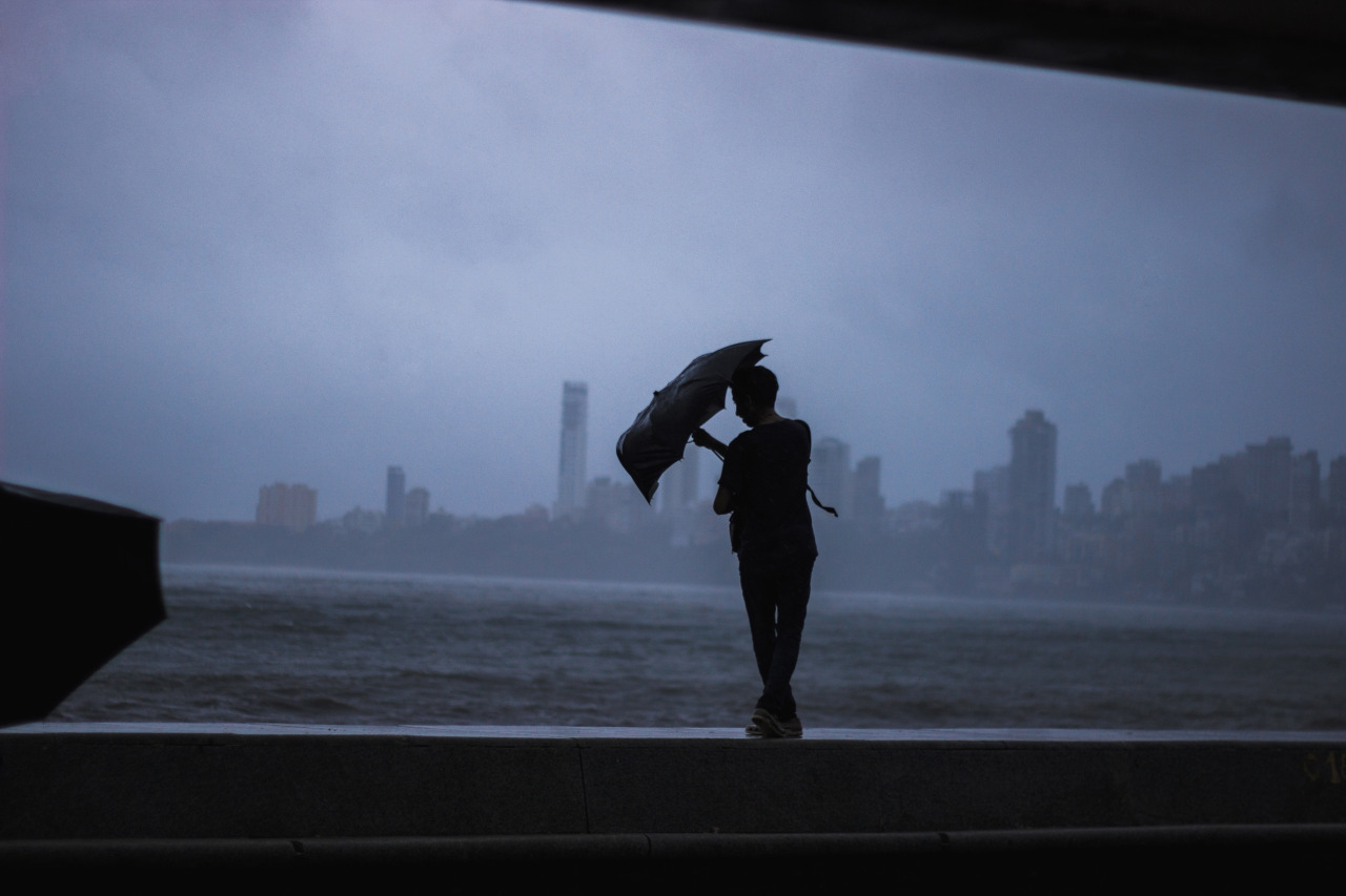 Umbrella struggles on a windy day as rains lash Bombay.
Taken at Marine Drive.
Bombay / Mumbai, India.